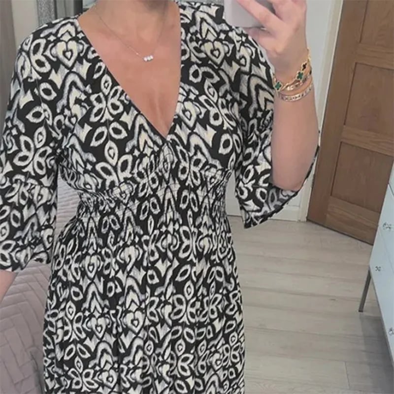 Robe Aria Noir - Décolleté en V, tissu léger pour une élégance féminine trave