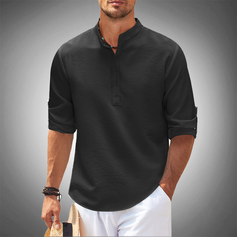 Chemise en lin contemporaine noire, manches retroussées et patte de boutonnage do