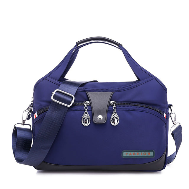 Sac à main WanderChic bleu foncé avec protection antivol et bretelles réglables pour femmes
